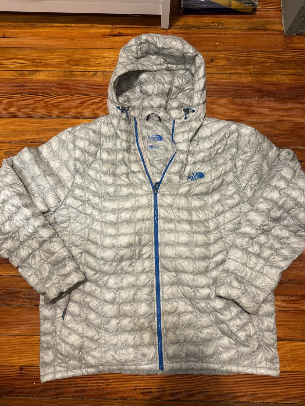 The North Face Men's Silver Hooded thermoball Packable Puffer with Blue Trim